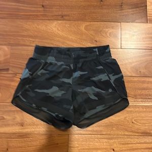 Athleta running shorts in camo with back pocket and mesh edged
